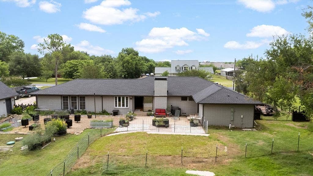216 Meadowlark Lane, Wylie, TX 75098 Back yard featuring many areas to entertain or garden.