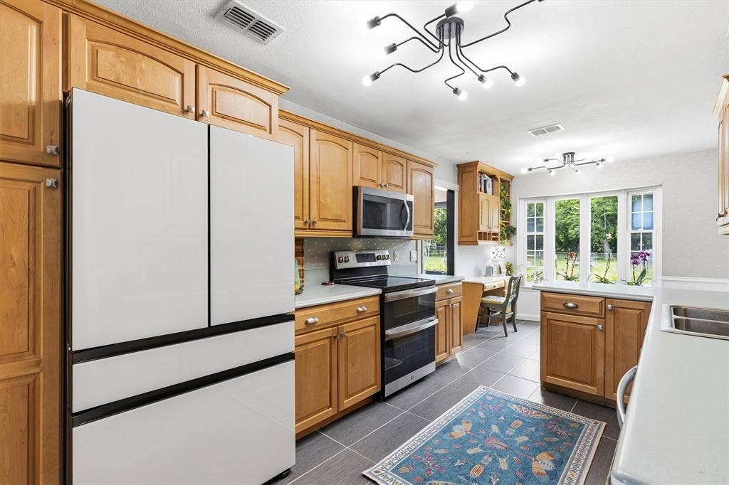 216 Meadowlark Lane, Wylie, TX 75098 Kitchen with Decorative Lighting.