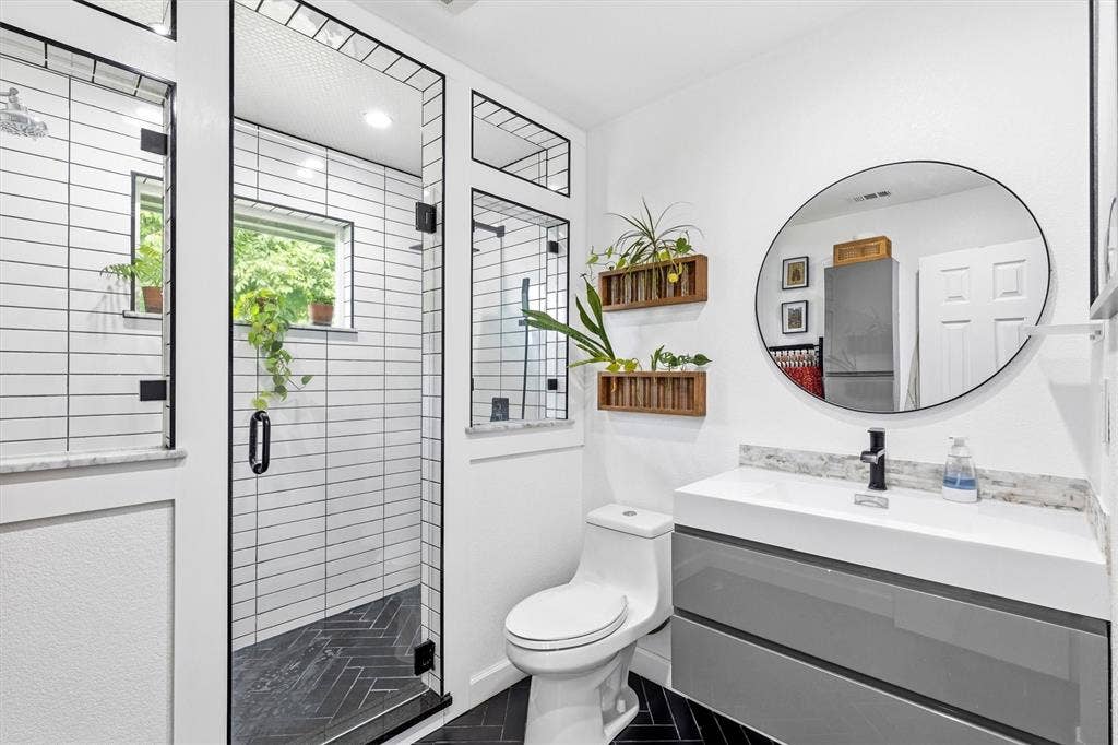 216 Meadowlark Lane, Wylie, TX 75098 Updated Primary Bath with Large Shower with Dual Shower Heads and Body Sprays.