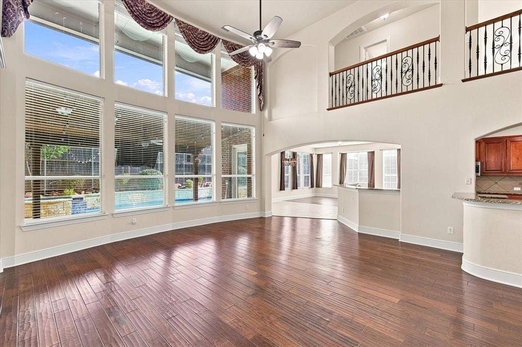 509 Wentworth Lane, Murphy, TX 75094 Two-story living area with wood-finish flooring