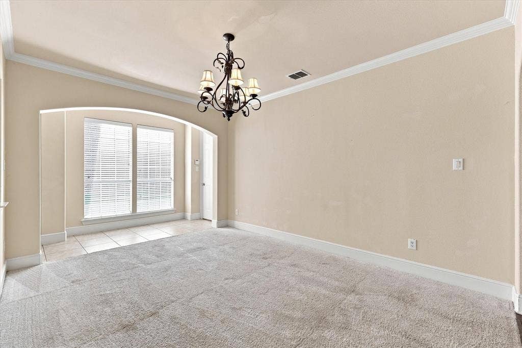 509 Wentworth Lane, Murphy, TX 75094 Recessed arched opening framing dual windows with plantation shutters