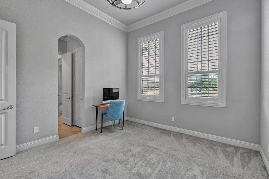 6412 Preferred Drive, Fort Worth, TX 76179 Interior room featuring light gray walls, plush gray carpet, and white crown molding
