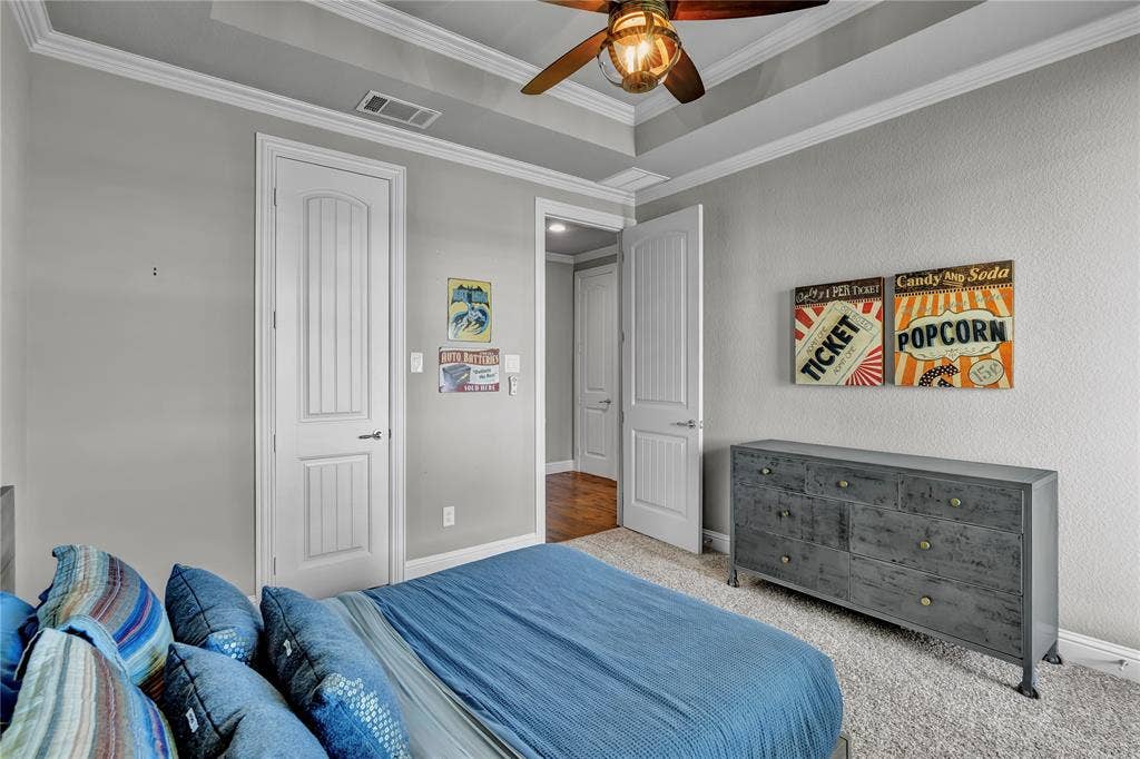 6412 Preferred Drive, Fort Worth, TX 76179 Carpeted interior space featuring tray ceiling with ceiling fan and light fixture