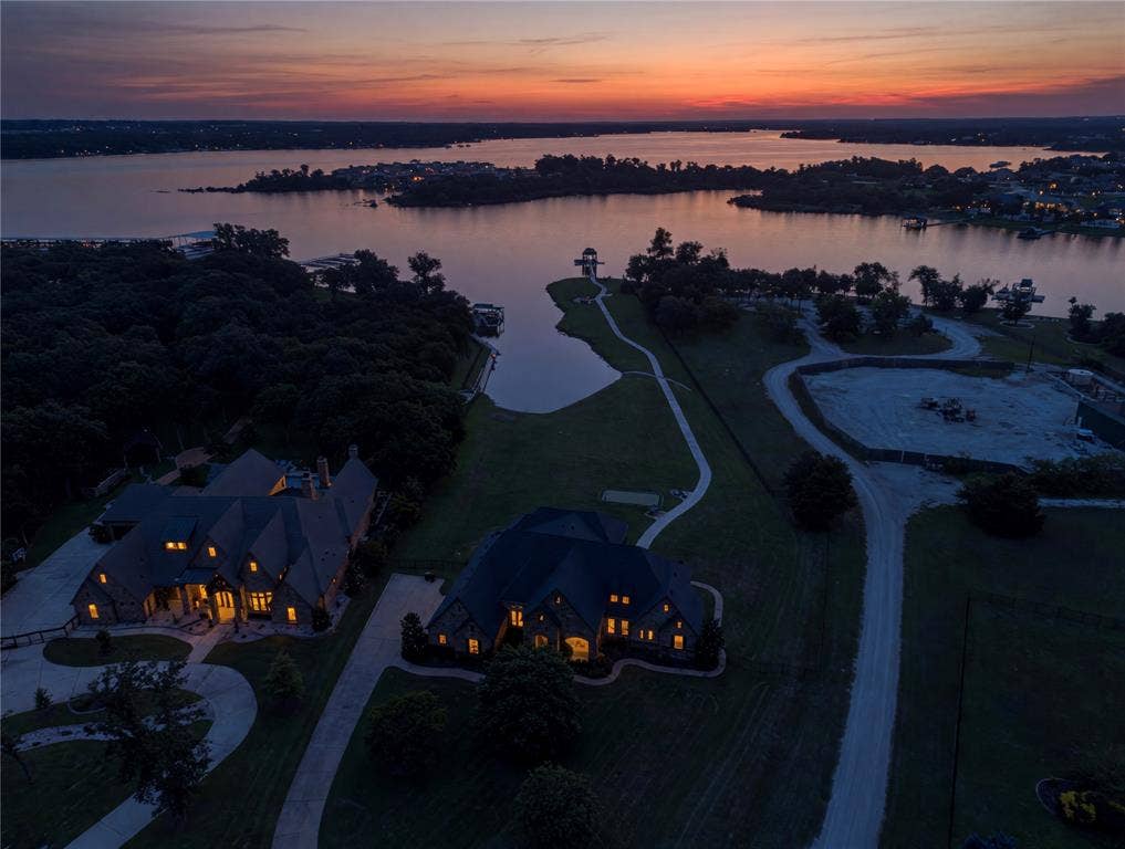 6412 Preferred Drive, Fort Worth, TX 76179 Waterfront property featuring two distinct residences, a private water inlet, and a winding paved pathway leading to a lakeside gazebo