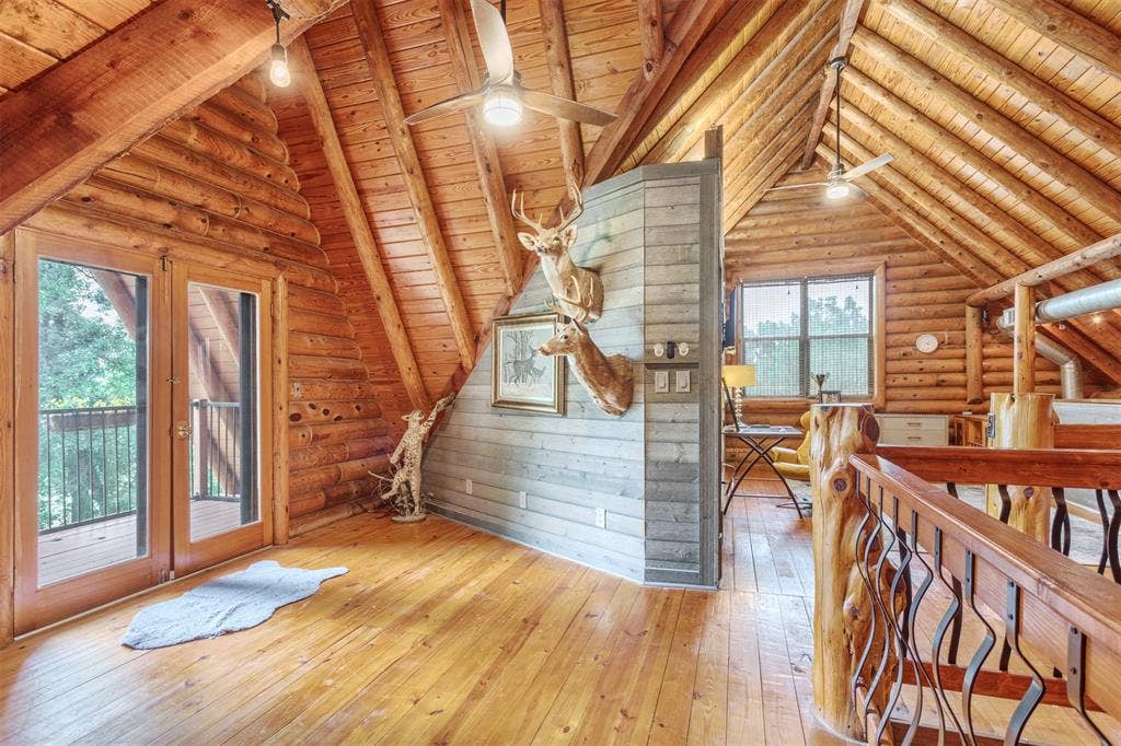 Balcony off the loft area overlooking the front of the property, full bath, living space, closet, storage and sleeping area.