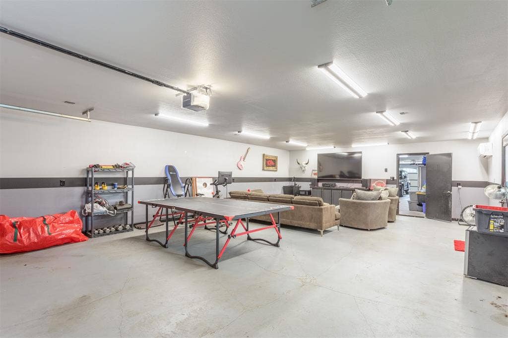 Attached workshop will house 4 cars or flex space for your man cave, kids gameroom, workout room, etc. Private ntry door to backyard along with overhead doors, built in sink, access to the home through the attached garage