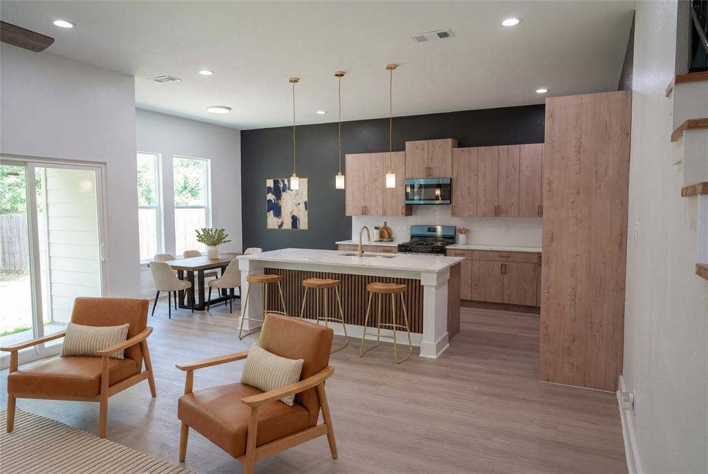2823 Curvilinear Court, Dallas, TX 75227 View of kitchen from the living area has been virtually staged