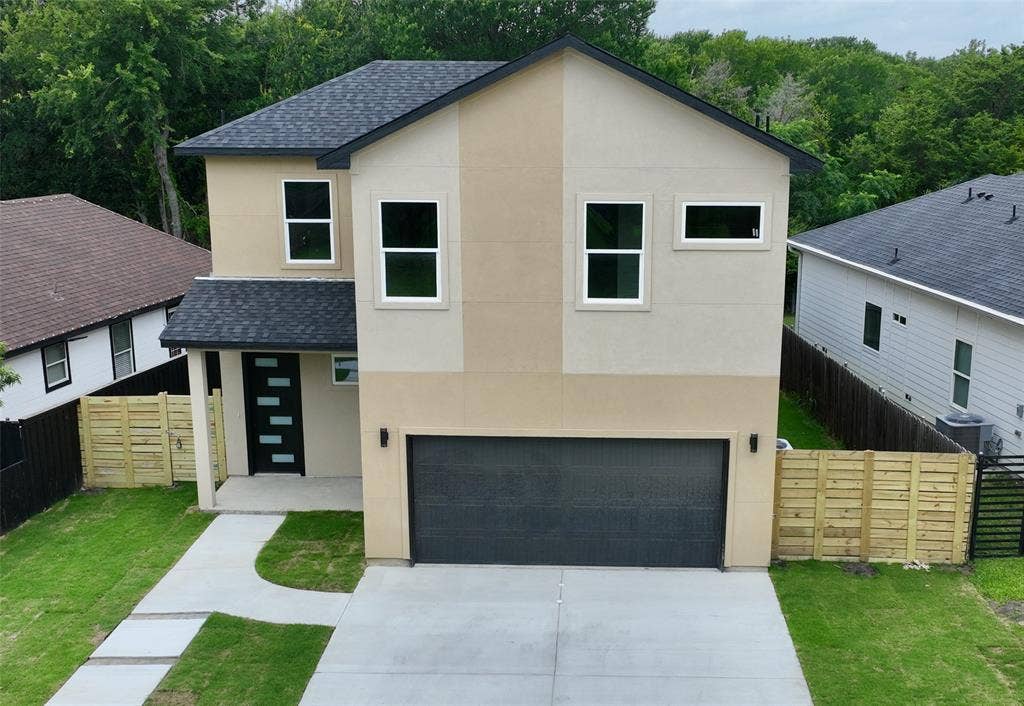 2823 Curvilinear Court, Dallas, TX 75227 Contemporary two-story residence featuring a dual-tone stucco exterior