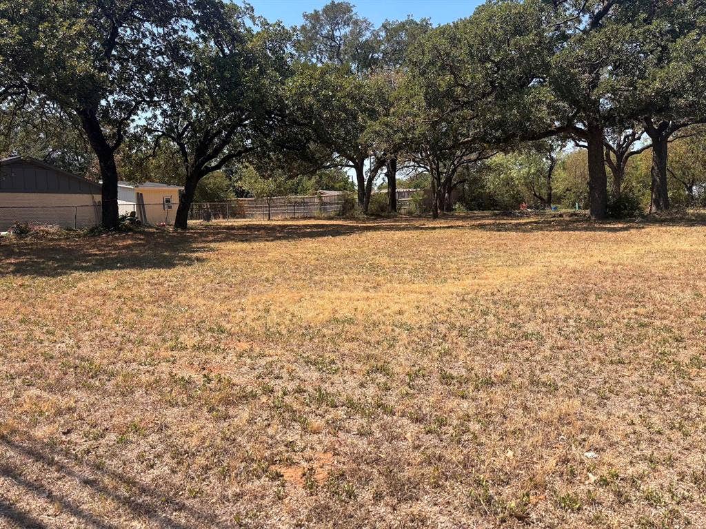 1441 Hurstview Drive, Hurst, TX 76053 Expansive lot with mature trees and partial fencing