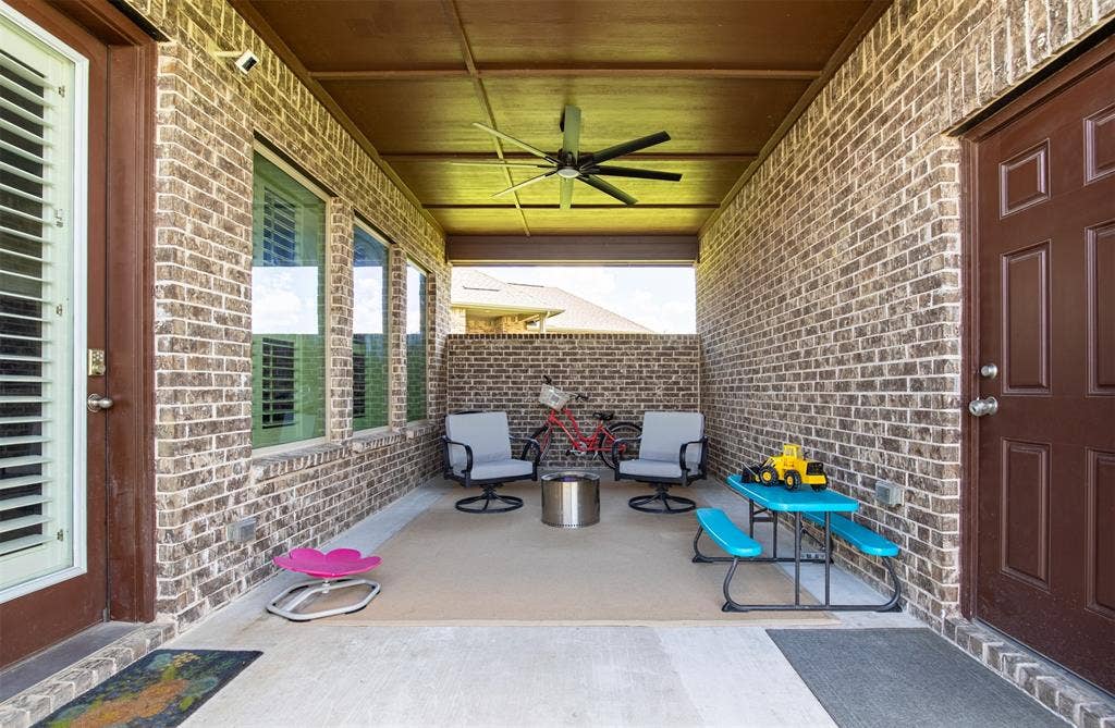 721 Matchbox Street, Argyle, TX 76226 Covered patio is perfect for grilling, watching football, exercising, or just relaxing and watching the kids enjoy the large yard.