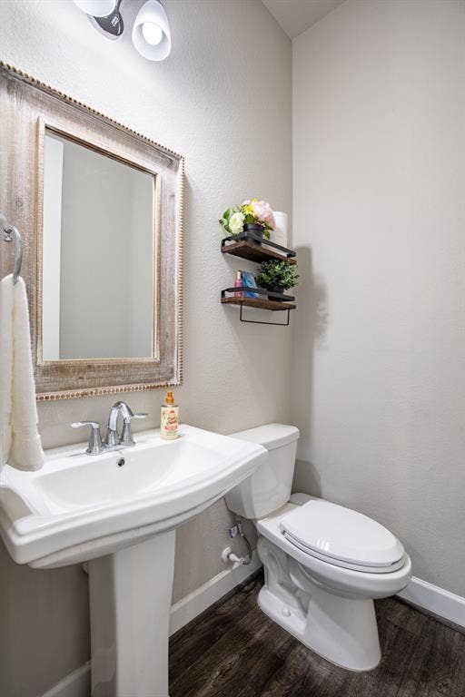721 Matchbox Street, Argyle, TX 76226 Powder bath located in hallway towards laundry room.