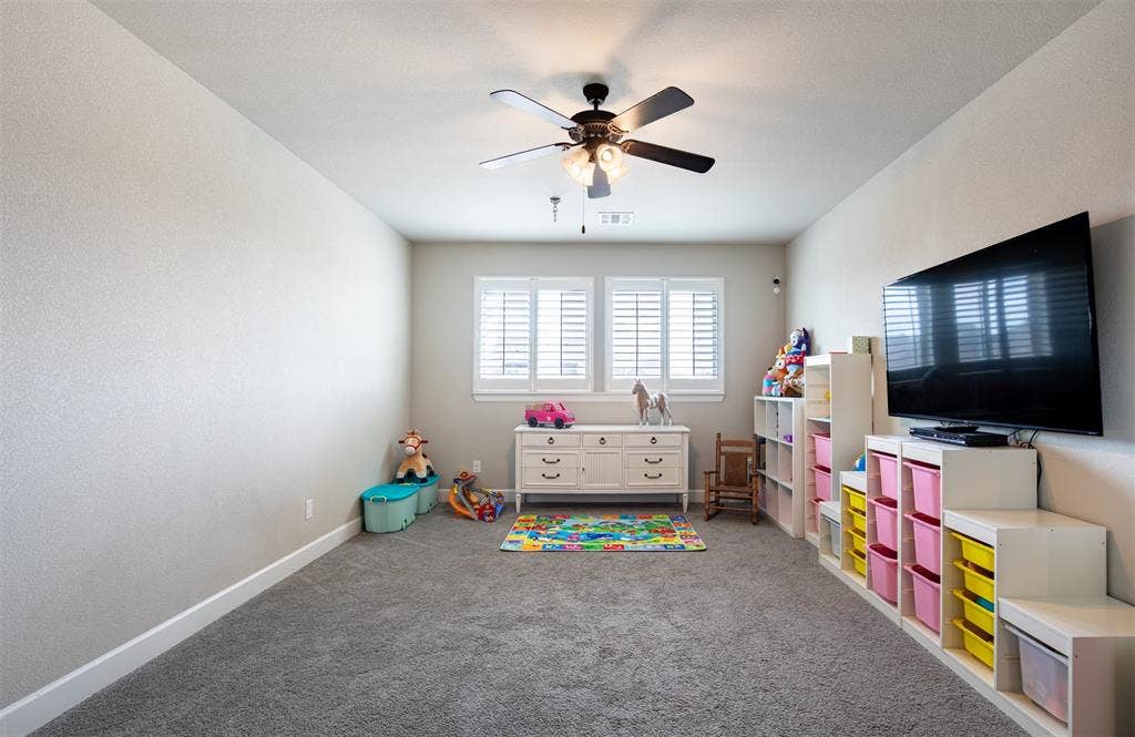 721 Matchbox Street, Argyle, TX 76226 Bonus room can be used as a game room or secondary living area. Right off of the bonus room is a door to the attic with decking perfect for storing those holiday decorations.