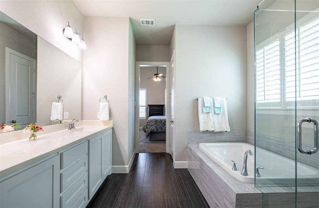 721 Matchbox Street, Argyle, TX 76226 Ensuite primary bathroom with standalone tub.