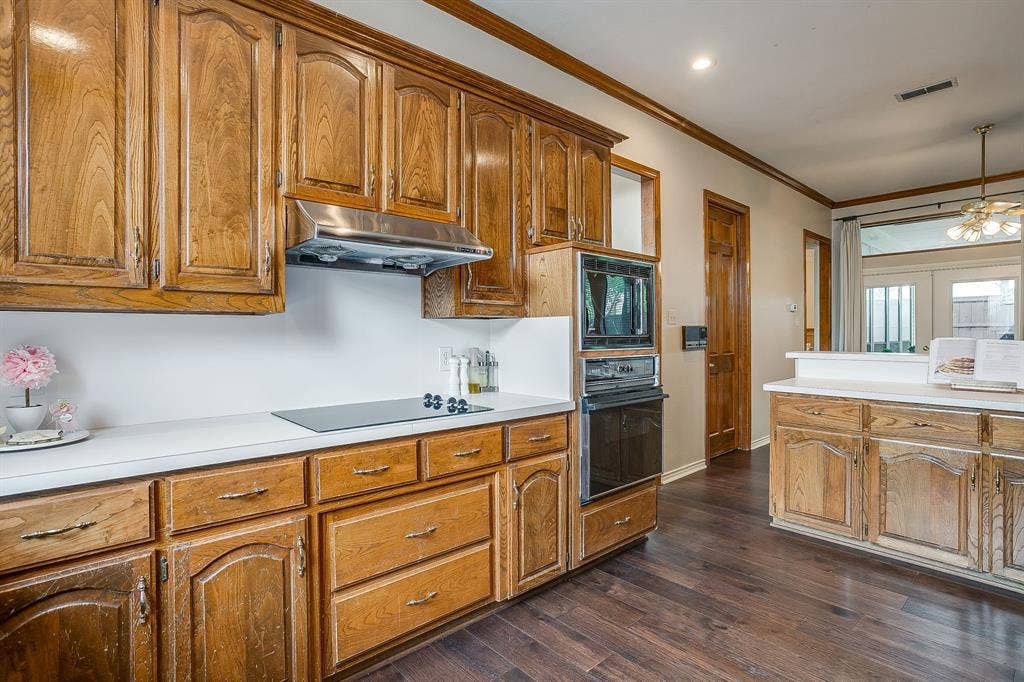 4624 Reunion Drive, Plano, TX 75024 Kitchen featuring wood-finish cabinetry, white countertops, a built-in oven, a built-in microwave and cooktop