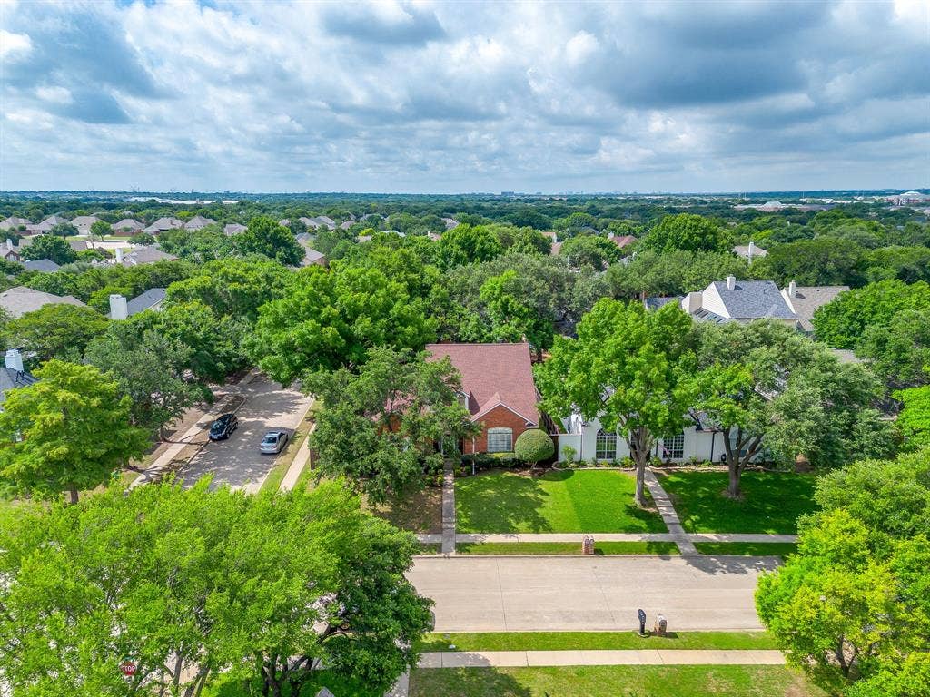 4624 Reunion Drive, Plano, TX 75024 Residential property featuring a brick exterior on a corner lot