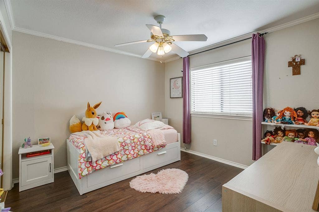 4624 Reunion Drive, Plano, TX 75024 Bright room featuring wood flooring, a ceiling fan with integrated lighting, and a window with blinds