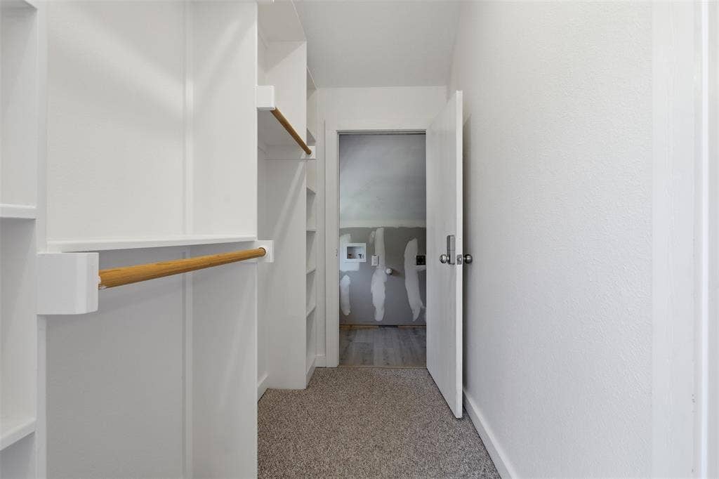 6107 Grande Cove Court, Granbury, TX 76049 Primary closet up with private laundry in closet