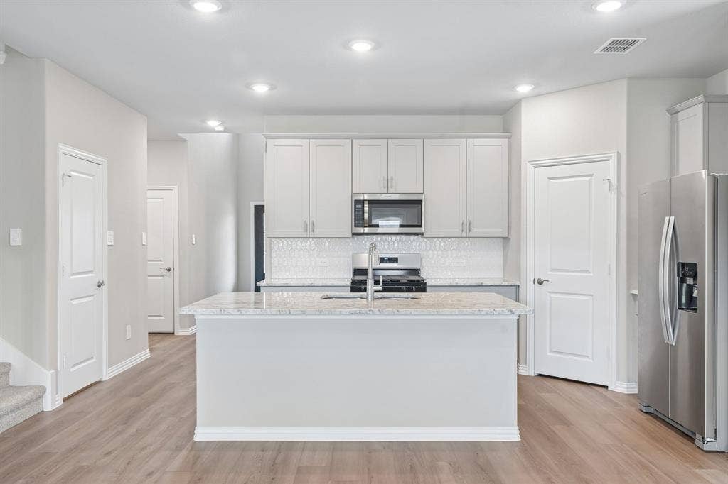 1934 Tradition Drive, Seagoville, TX 75159 Photo is not of the actual home, but is an inspirational photo of builder’s model home and may depict options, furnishings, and/or decorator features that are not included.