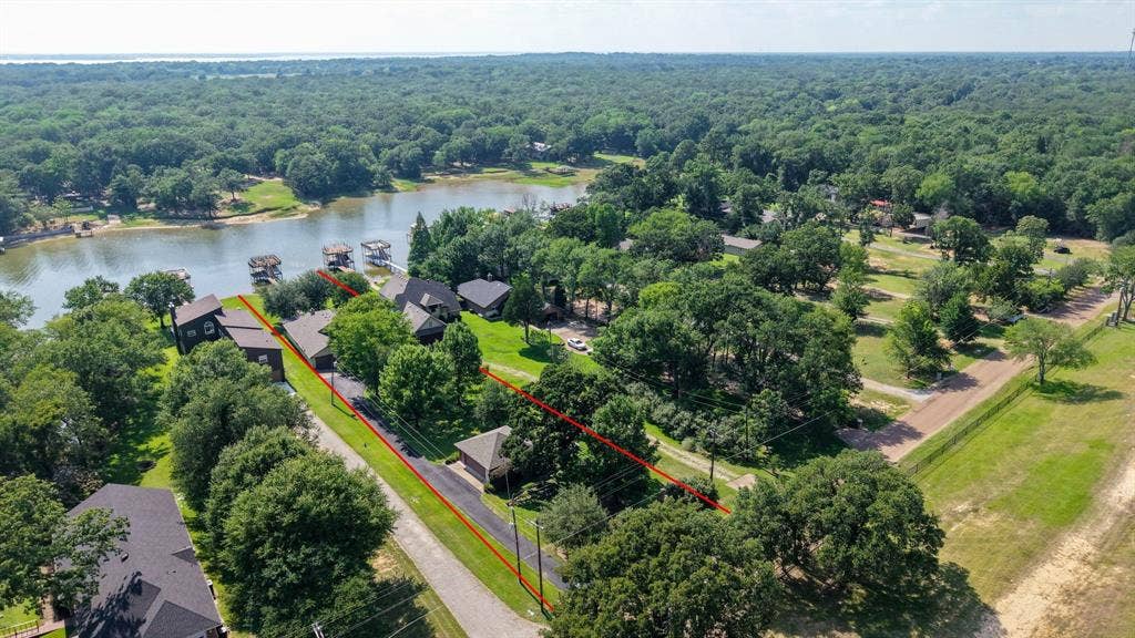 194 Bushwhacker Drive, Mabank, TX 75156 Rare waterfront retreat combining generous acreage, beautiful views, and outstanding lake amenities.