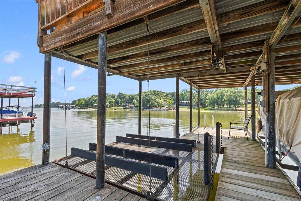 194 Bushwhacker Drive, Mabank, TX 75156 Dual personal watercraft lifts provide easy storage and launch access for lake adventures.