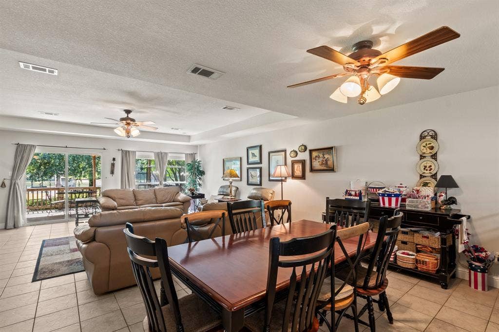 194 Bushwhacker Drive, Mabank, TX 75156 Dining space overlooking the lake and connected to the main living area.