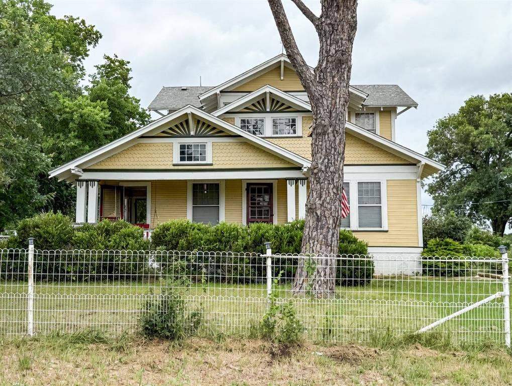 2749 Mcgregor South Loop, McGregor, TX 76657 Traditional-style residence featuring a prominent front porch, gabled roofs, and decorative shingle siding