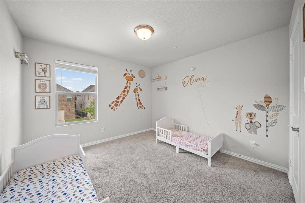4129 Bullwhip Creek Lane, Sachse, TX 75048 Carpeted room with a single window featuring horizontal blinds