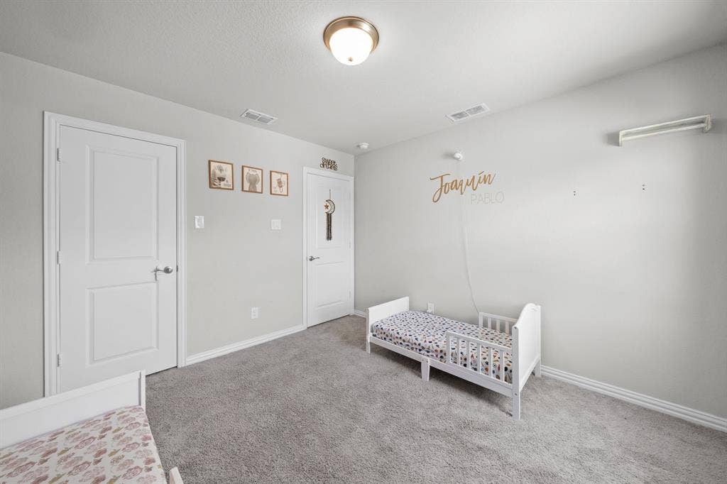 4129 Bullwhip Creek Lane, Sachse, TX 75048 Neutral gray walls complement the gray carpeting