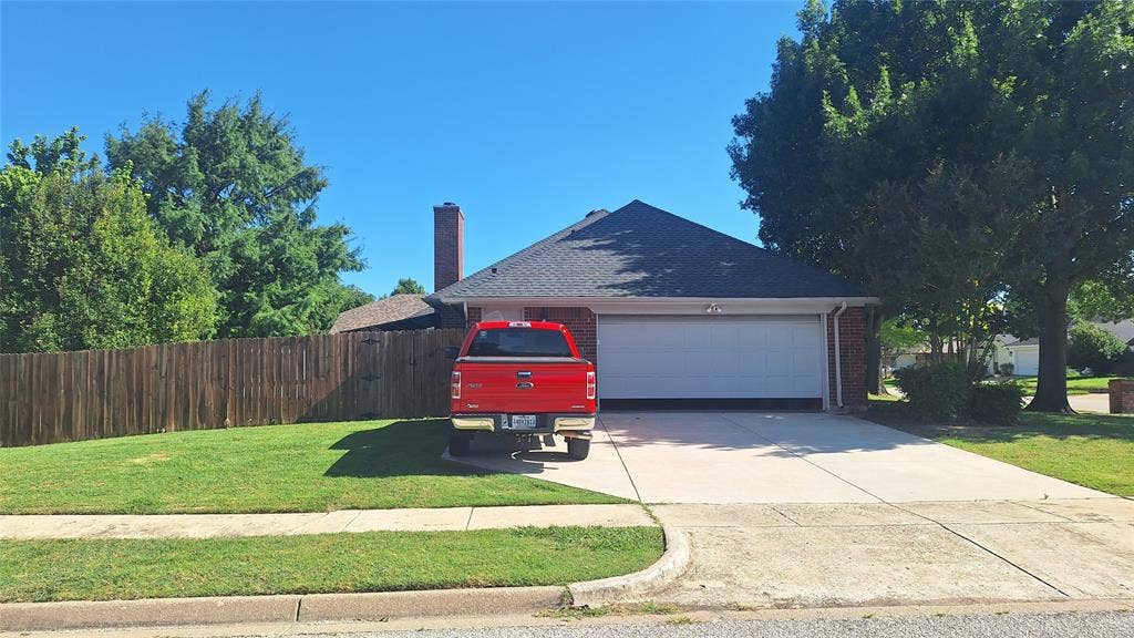 large side corner lot off Bear Creek with 3rd car parking pad.  & 2nd gate driveway entrance into backyard, plenty of space for rv or trailer parking to left of driveway