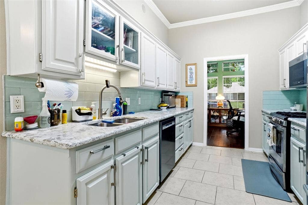 alaskan quartz counters with glass brick backsplash