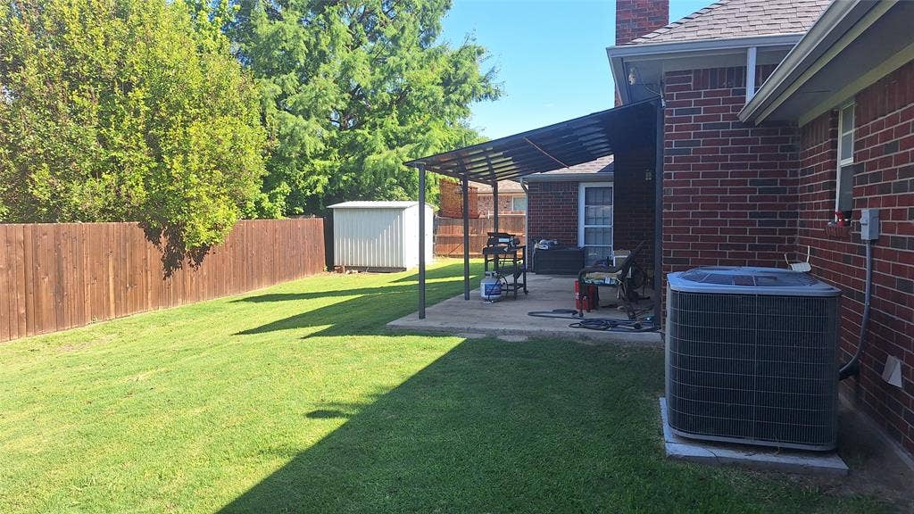eastern backyard with metal roof covered porch within 21x10 patio. metal shed, 4 ton AC, updated stained privacy fence