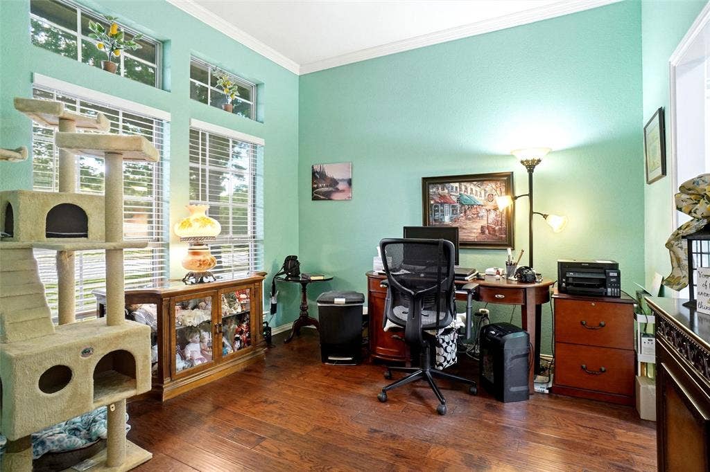 quiet front entry office or 2nd dining or living with engineered wood floor and crown mold at ceiling