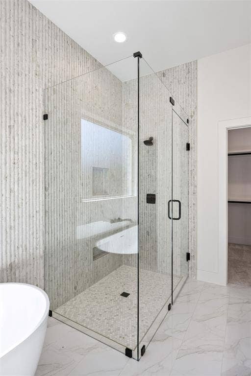 902 Boston Lane, River Oaks, TX 76114 Glass-enclosed shower with matte black fixtures, integrated bench, and mosaic tile flooring