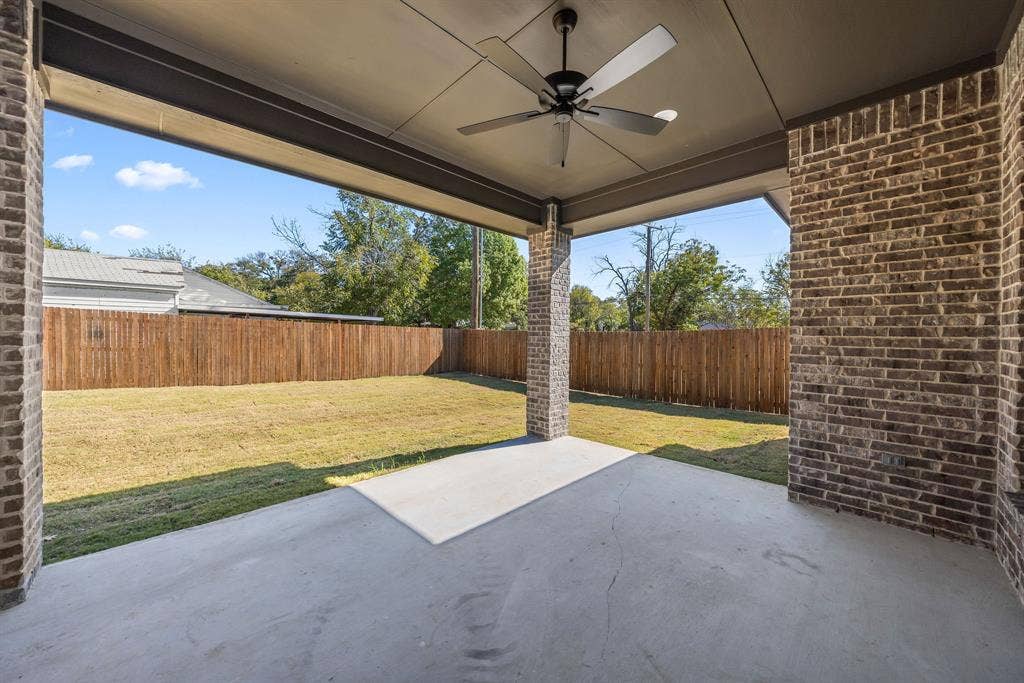 902 Boston Lane, River Oaks, TX 76114 Covered patio with a ceiling fan, concrete flooring, and brick support columns