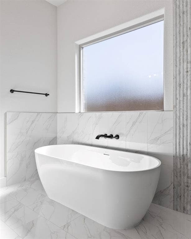 902 Boston Lane, River Oaks, TX 76114 Freestanding soaking tub with a wall-mounted matte black faucet