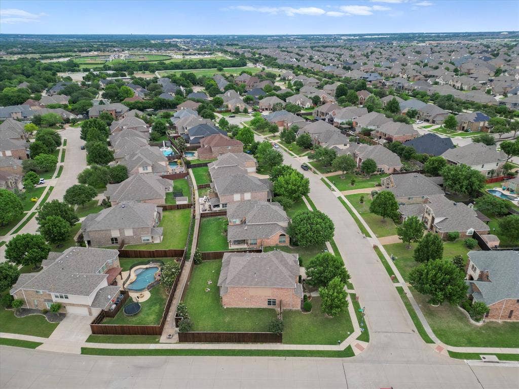 1621 Lakemere Drive, Prosper, TX 75078 Aerial perspective showcasing a residential neighborhood with numerous single-family homes