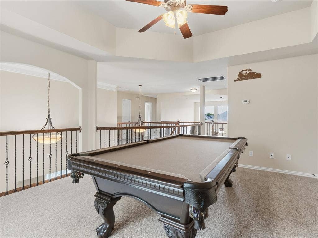 1621 Lakemere Drive, Prosper, TX 75078 Carpeted upper level featuring a decorative ceiling fan and open railing overlooking the lower level