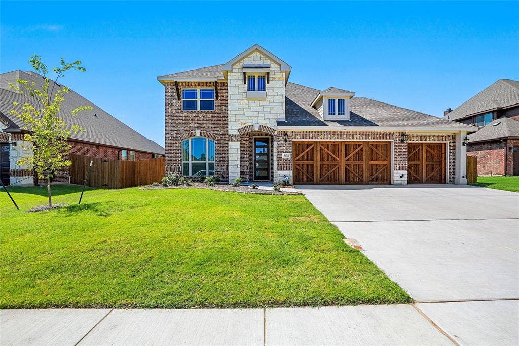 508 Bush Avenue, Waxahachie, TX 75165 Brick and stone exterior with a two-story elevation