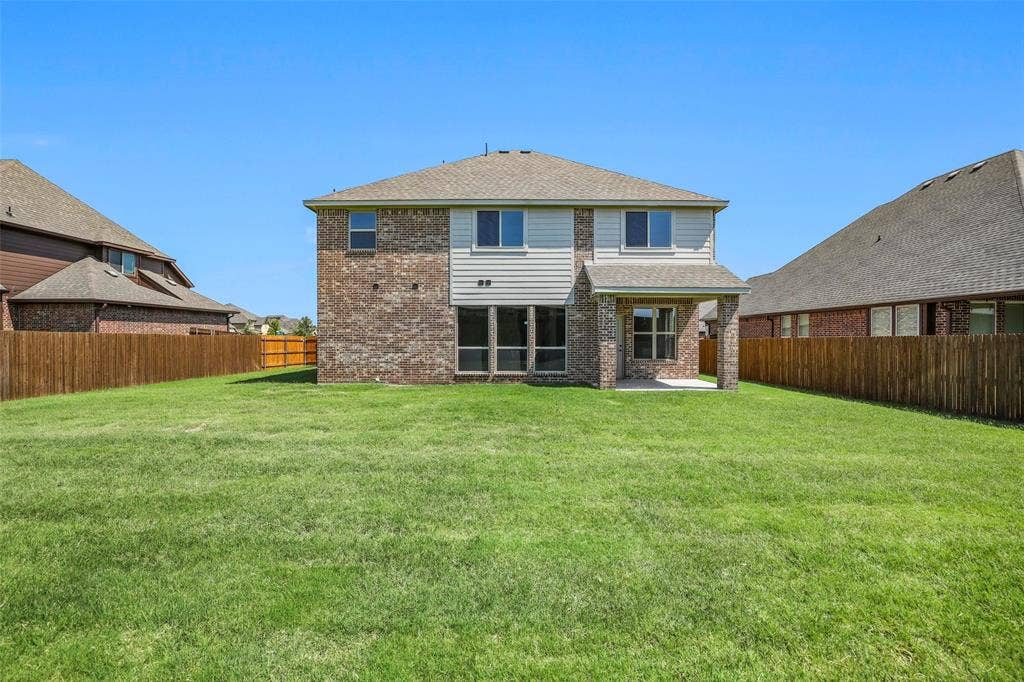 508 Bush Avenue, Waxahachie, TX 75165 Expansive green lawn providing ample outdoor space