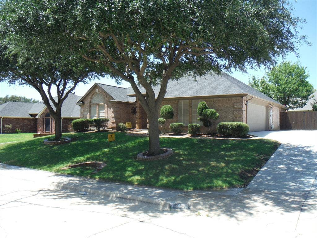 428 Shelby Drive, Burleson, TX 76028 Beautifull mature oak trees in front yard provide excellent shade.