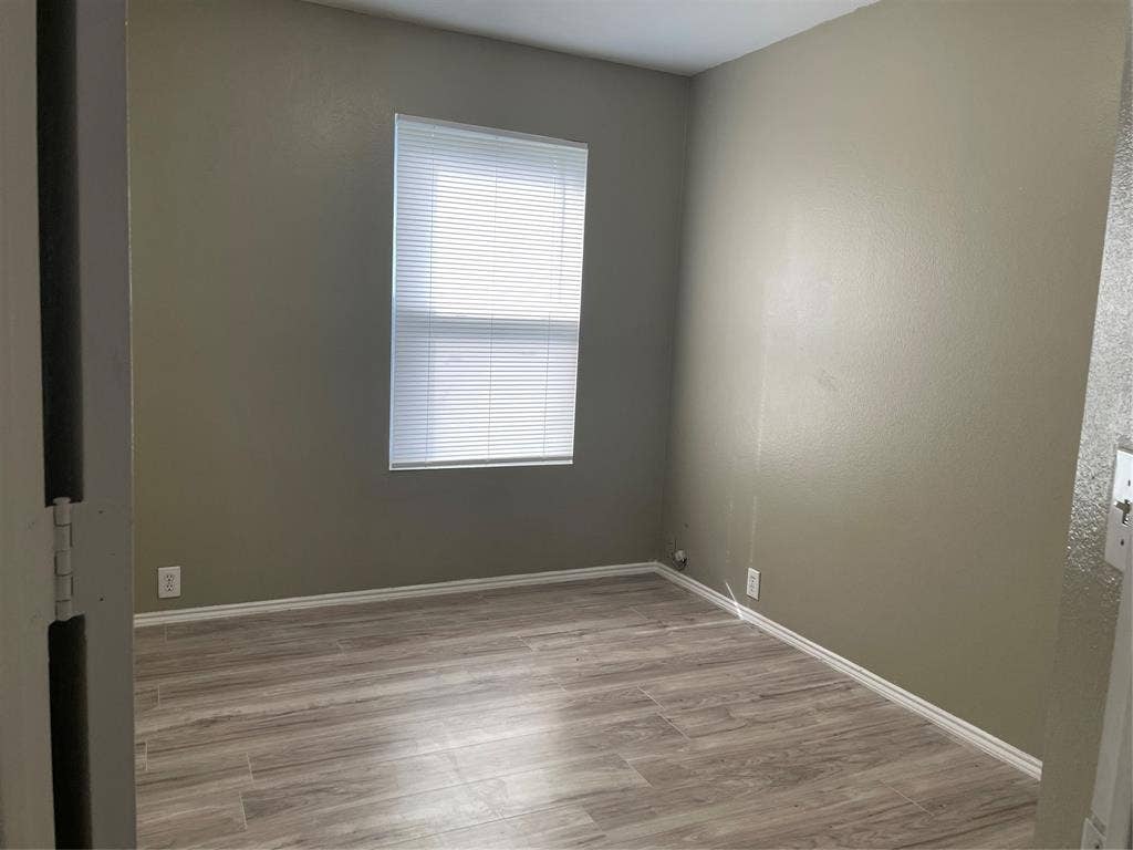 817 Greene Way, Wylie, TX 75098 Light wood-finish flooring with white baseboards and neutral wall tones