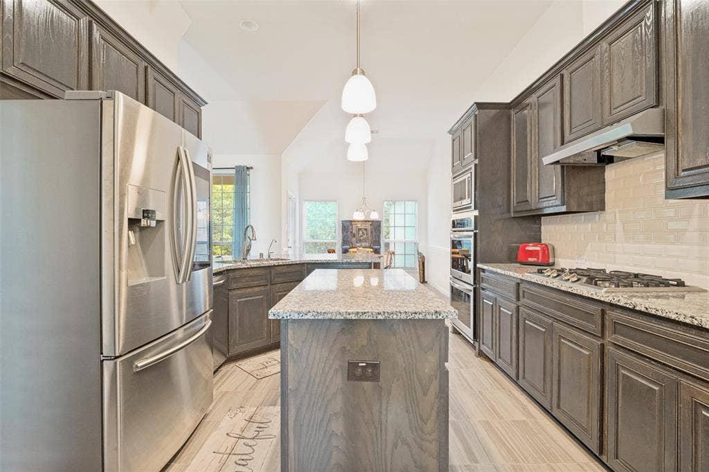 824 State Street, DeSoto, TX 75115 Stainless steel appliances with built in microwave and double oven.