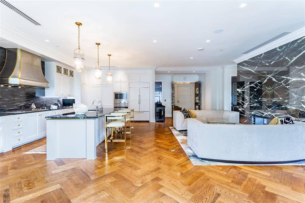 2300 WOLF Street, #5D, Dallas, TX 75201 Herringbone patterned wood floors throughout the residence.