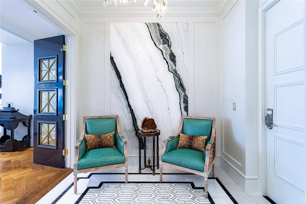 2300 WOLF Street, #5D, Dallas, TX 75201 Foyer features a beautiful Panda Stone wall & custom brass-trimmed enamel French Doors.
