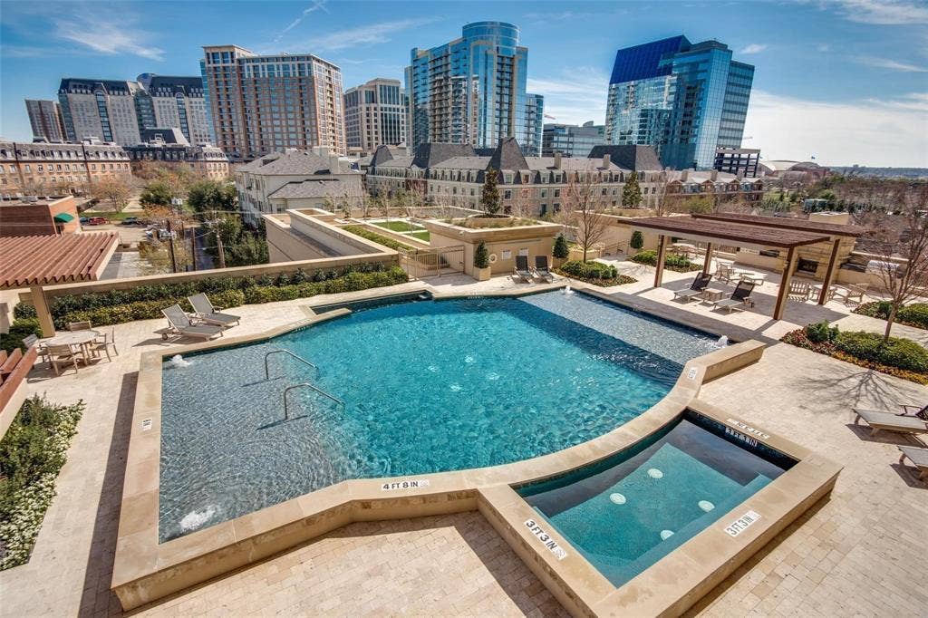 2300 WOLF Street, #5D, Dallas, TX 75201 Evening skyline views are stunning past the pool and spa.