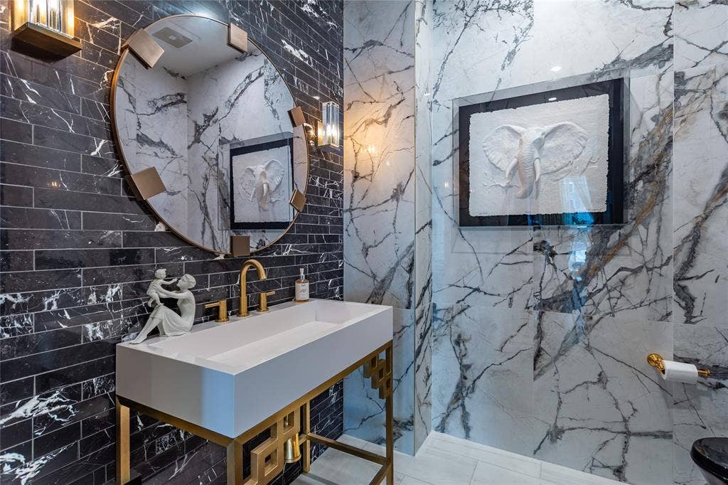 2300 WOLF Street, #5D, Dallas, TX 75201 Custom Sink in the marble Powder Room.