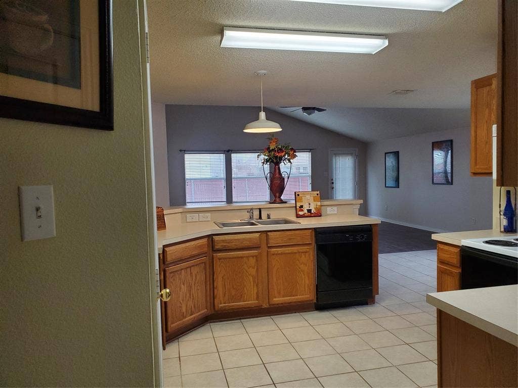 5005 Boxwood Lane, McKinney, TX 75070 Open view of kitchen, breakfast and family room.