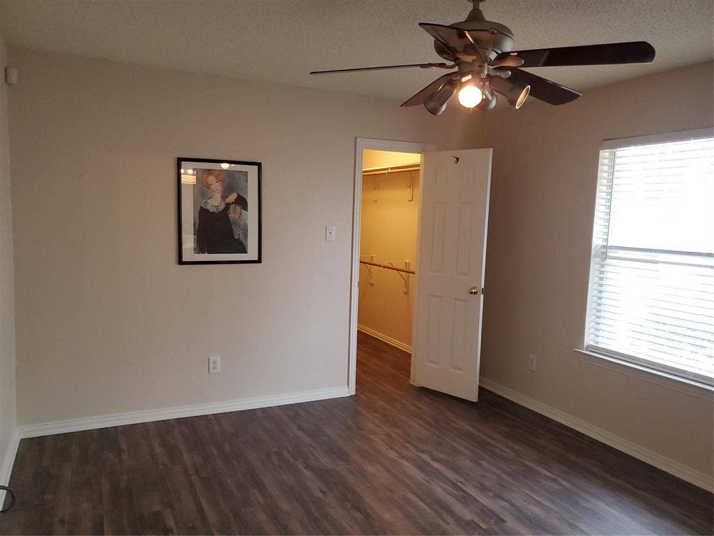 5005 Boxwood Lane, McKinney, TX 75070 Primary bedroom in the back with ceiling fan.