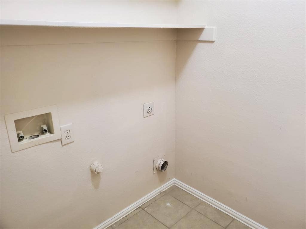 5005 Boxwood Lane, McKinney, TX 75070 Laundry with washer, dryer hookup. Next to kitchen can double as extended pantry.