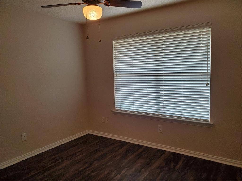 5005 Boxwood Lane, McKinney, TX 75070 3rd bedroom. Ceiling fan and all windows have blinds.